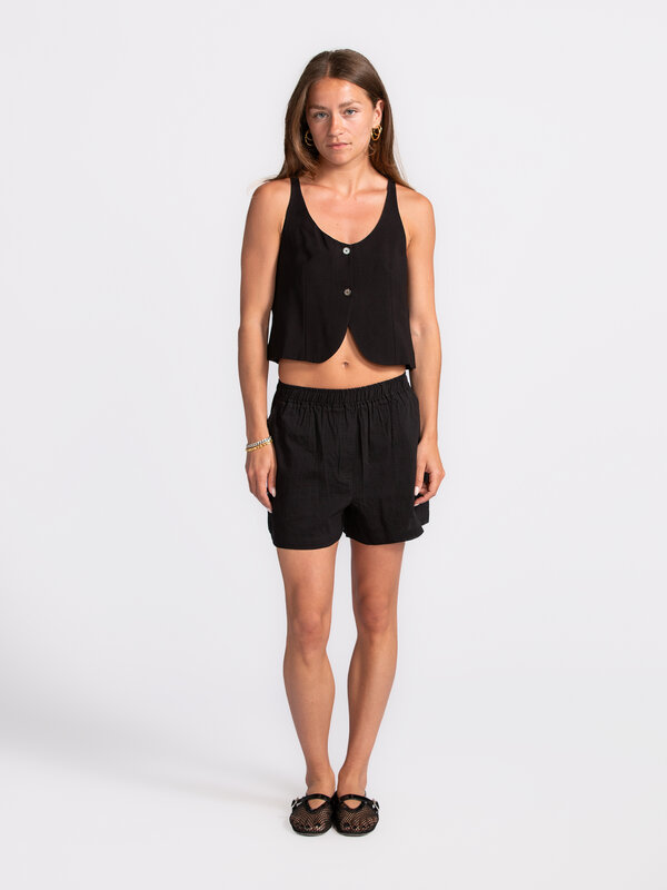 Edited Sleeveless top Simone 4. Black beauty – where elegance meets city chic. The perfect top for a lunch date or romant...