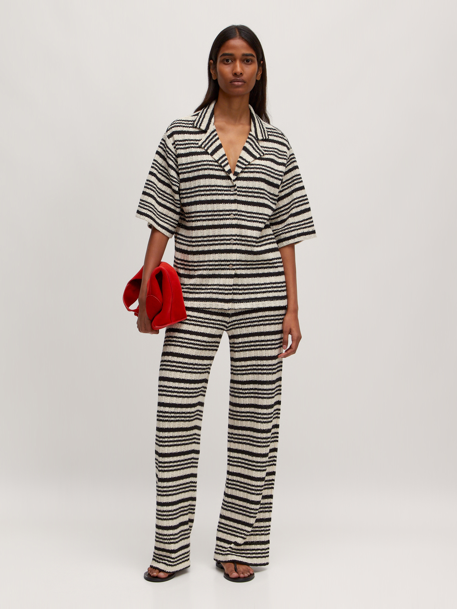 Edited Striped trousers Finn 4. A touch of seventies. These breezy black-and-white striped trousers bring retro flair. Wi...