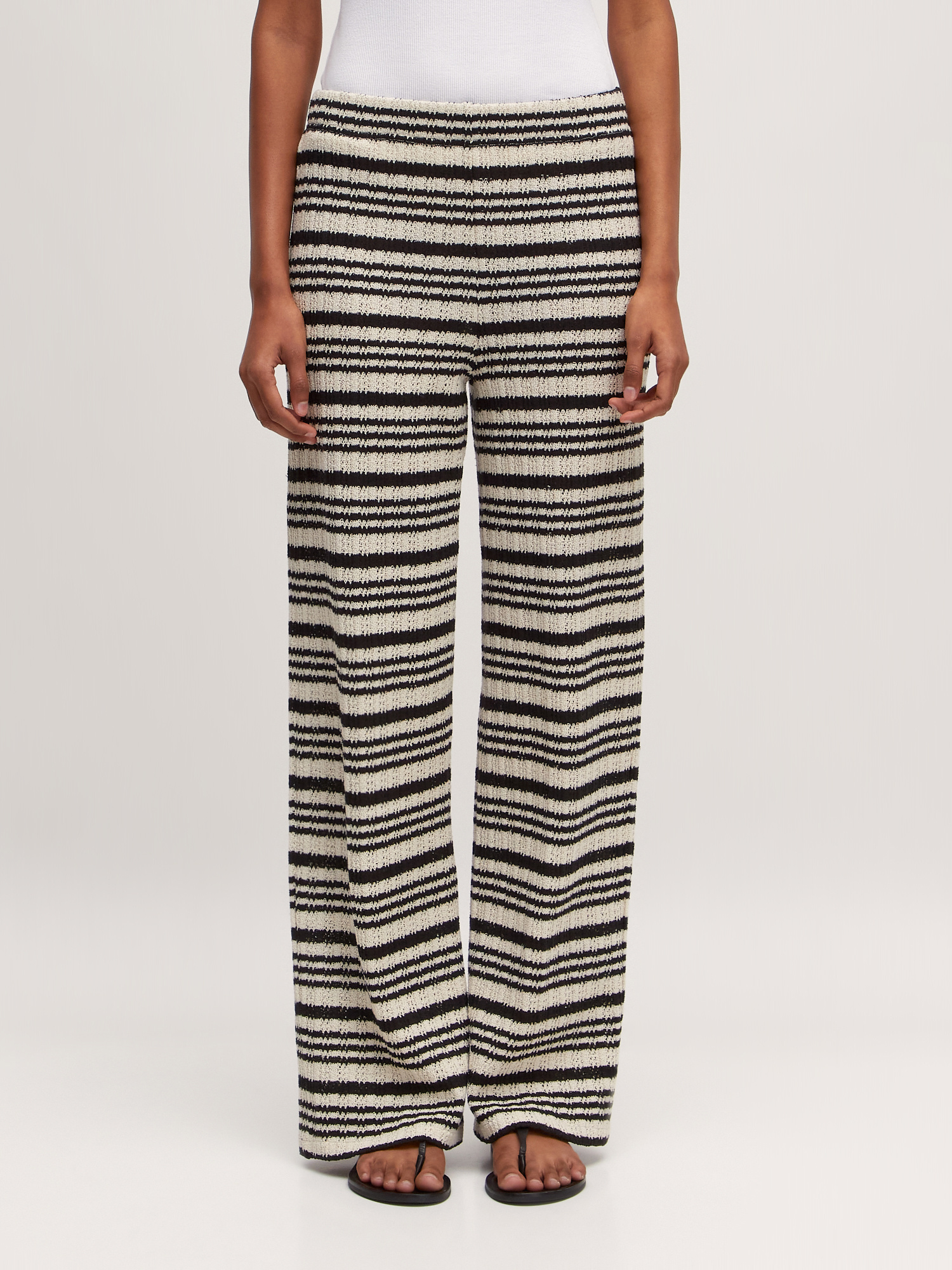 Edited Striped trousers Finn 2. A touch of seventies. These breezy black-and-white striped trousers bring retro flair. Wi...