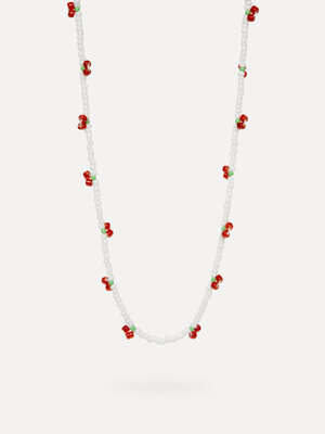 Collier Ana. Cherry vibes only. Ce collier perlé aux cerises rouges et perles blanches apporte une touche ludique à votre...