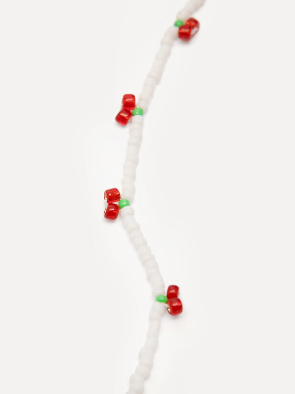 Les Soeurs Beaded necklace Ana Cherries 3. Cherry vibes only. This fun necklace with white beads and red cherries adds a ...