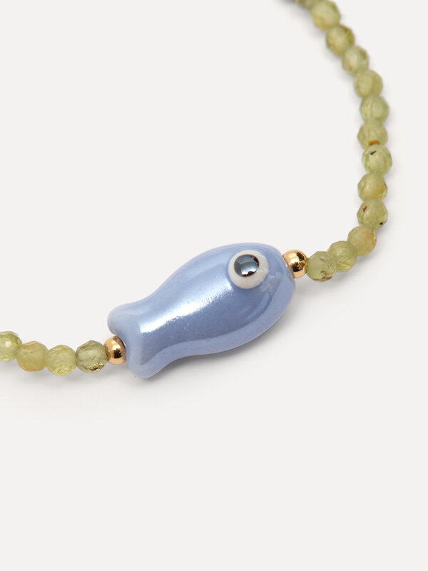 Les Soeurs Bracelet Lenni fish 3. So-fish-ticated. This charming bracelet with green beads and a bold fish detail brings ...