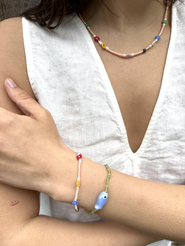 Les Soeurs Bracelet Lenni fish 2. So-fish-ticated. This charming bracelet with green beads and a bold fish detail brings ...