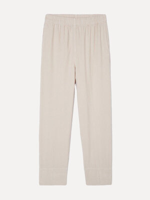 Geribde broek Padow. Effortless in ecru. Deze corduroy broek met losse fit en hoge taille combineert comfort met stijl. D...
