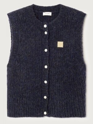 Gebreide vest East. De East mouwloze knit valt op door zijn fluffy textuur en verfijnde afwerking. Gebreid uit Italiaanse...