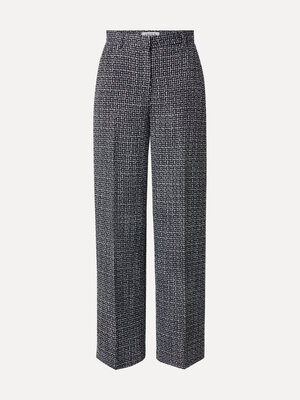 Tweed broek Nalani. Deze zwart-witte tweed broek combineert tijdloze elegantie met een moderne twist. Het subtiele tweedm...