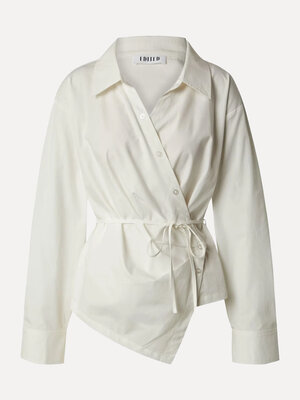 Blouse portefeuille Lillith. La blouse Lillith associe un style chemise classique à une coupe portefeuille moderne. La ma...