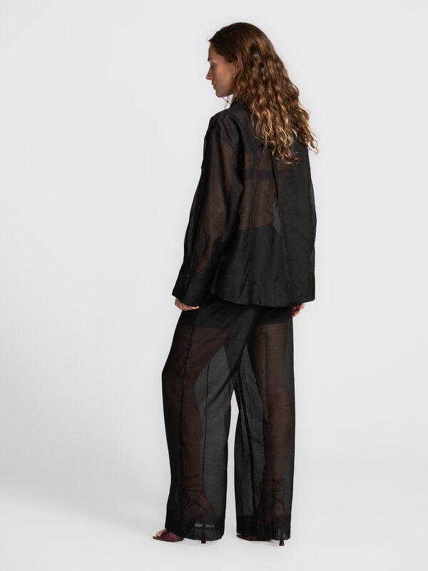 Edited Sheer shirt Saara 5. Sheer elegance. This transparent blouse takes any outfit to the next level. Pair with a brale...