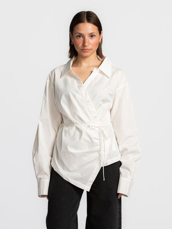Edited Wrap blouse Lillith 1. Elegant and timeless. This blouse merges a classic button-down style with a modern wrap des...