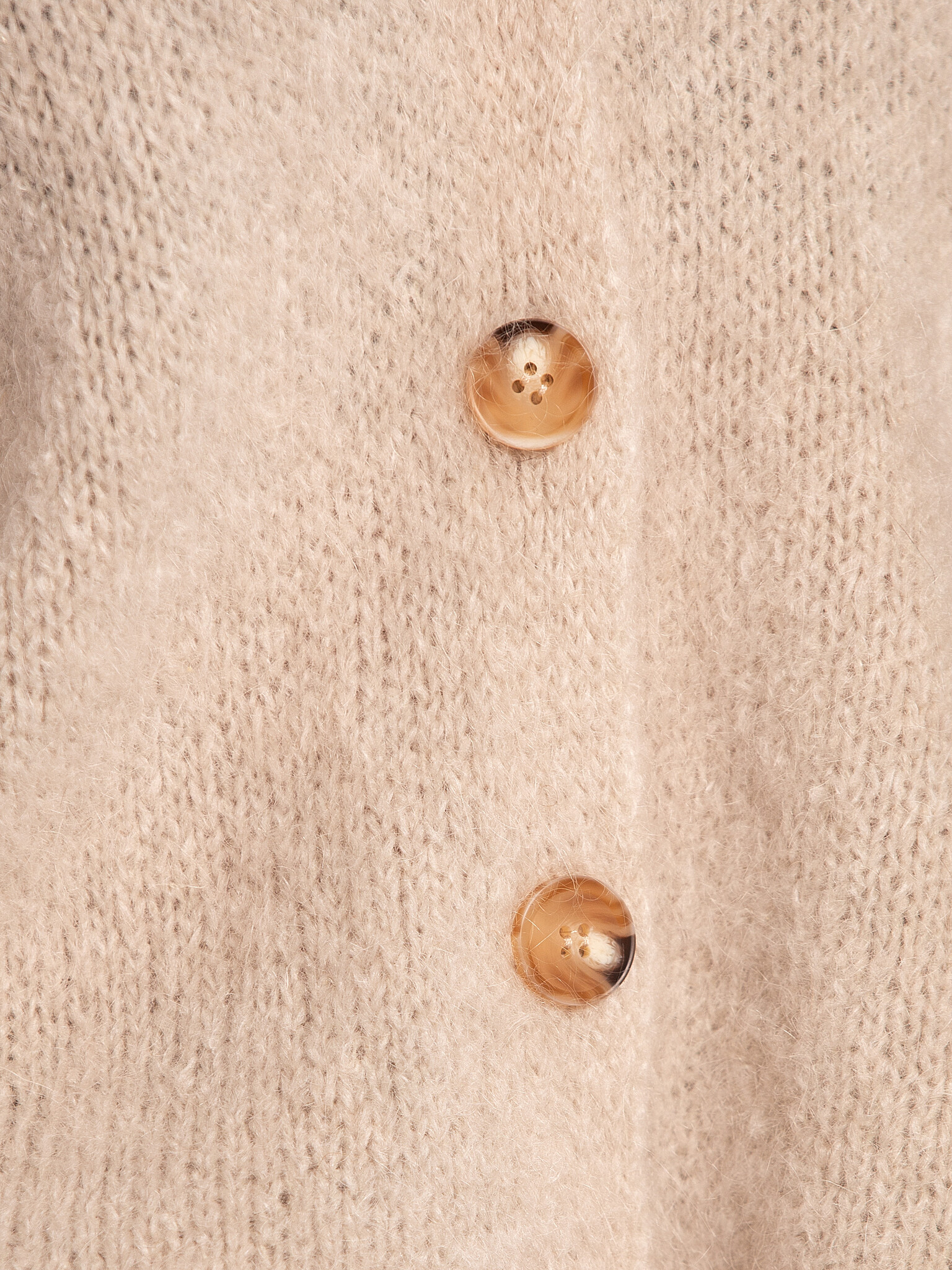 Le Marais Sleeveless knitted vest Live 6. Off-white, the color of infinite styling options. This cardigan not only goes w...