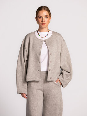 Sweat jacket Jilian. This grey sweater cardigan is a versatile must-have for your autumn wardrobe. Soft organic cotton pr...