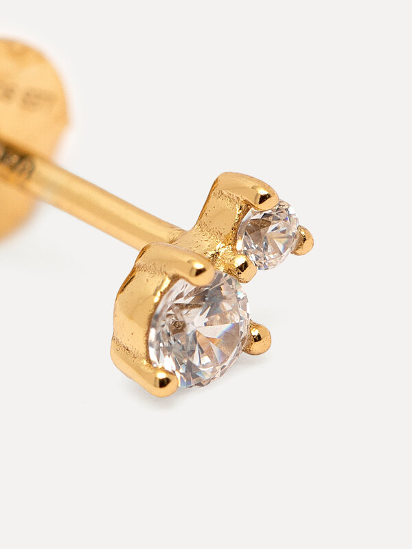 Les Soeurs Earring Jolie Round Duo 2. This small gold stud earring with two delicate stones blends classic elegance with ...