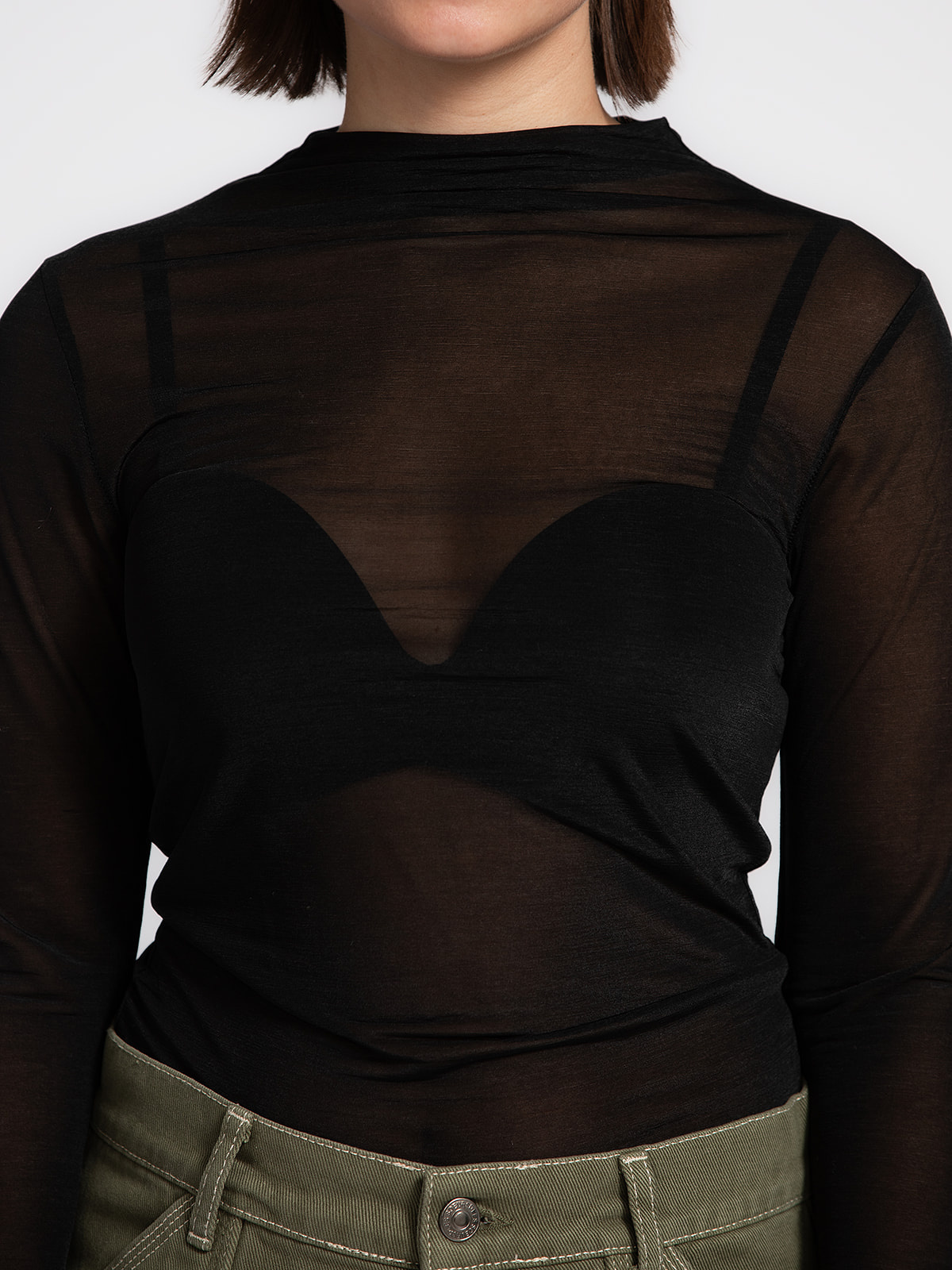 Edited Mesh longsleeve Leela 4. This black mesh longsleeve adds a refined edge to any outfit. The sheer fabric reveals su...