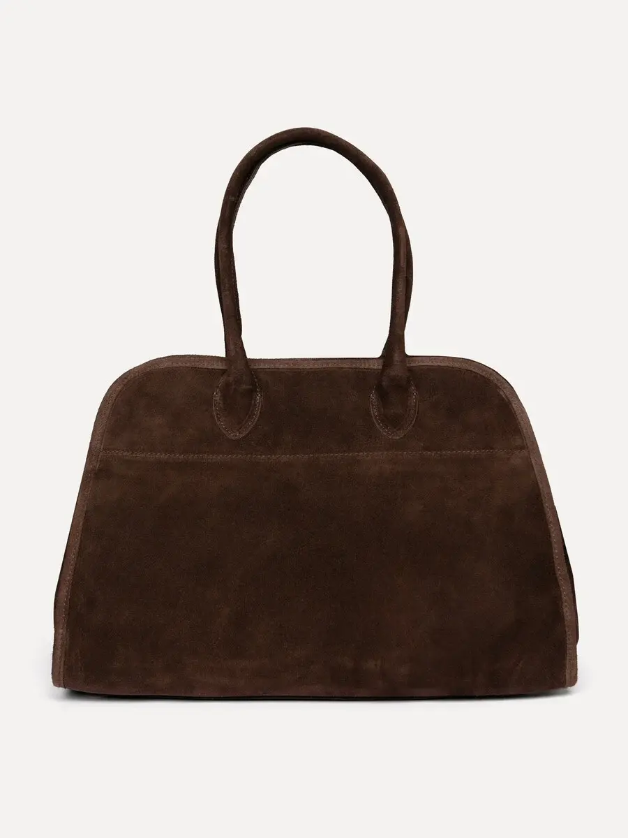 Le Marais Suède Handtas Henri 7. Espresso martini of belangrijke meeting? Deze handtas past bij elke gelegenheid. Het zac...