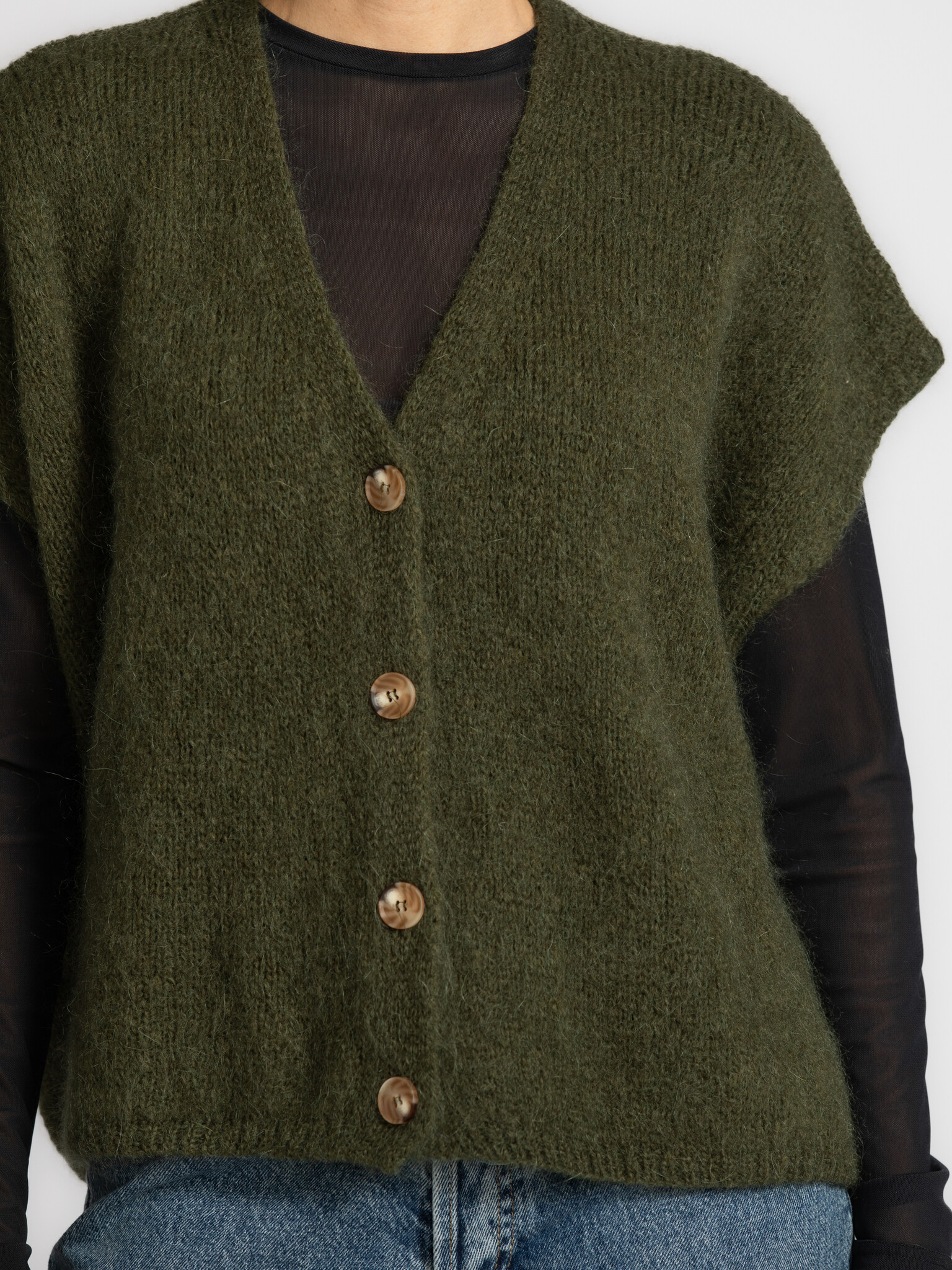 Le Marais Sleeveless knitted vest Live 4. Give your winter look a stylish upgrade with this sleeveless vest. The soft kni...