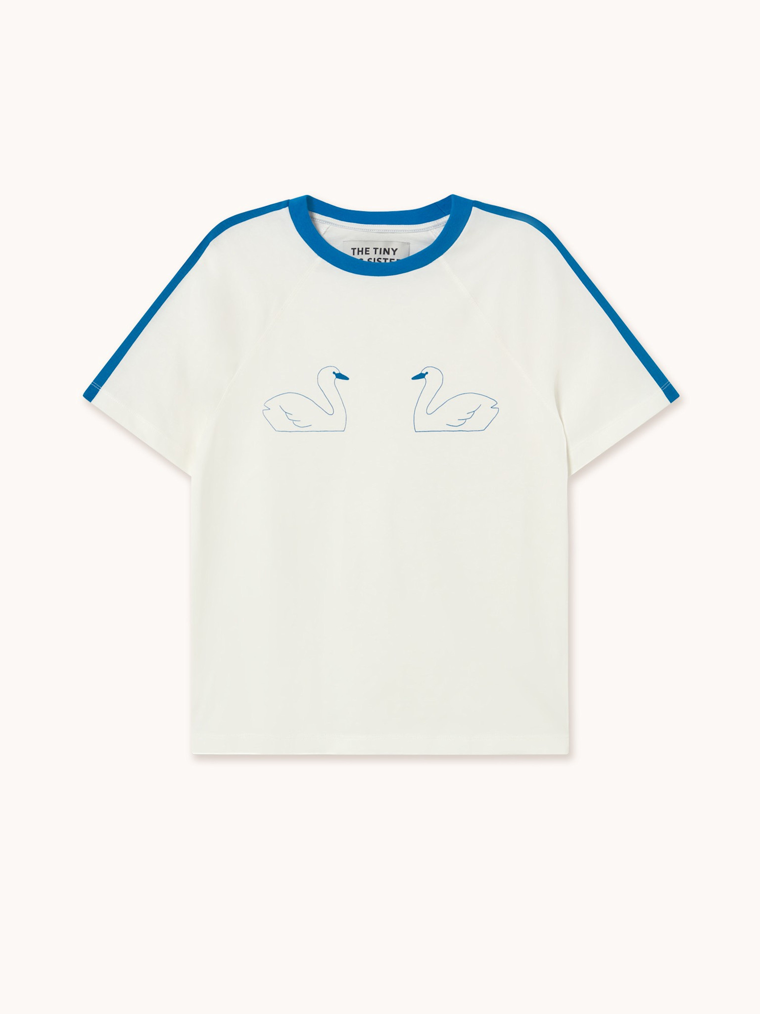 The tiny big sister T-shirt Swans 2. Équilibre en bleu. L’imprimé minimaliste de colombes et les finitions contrastées do...