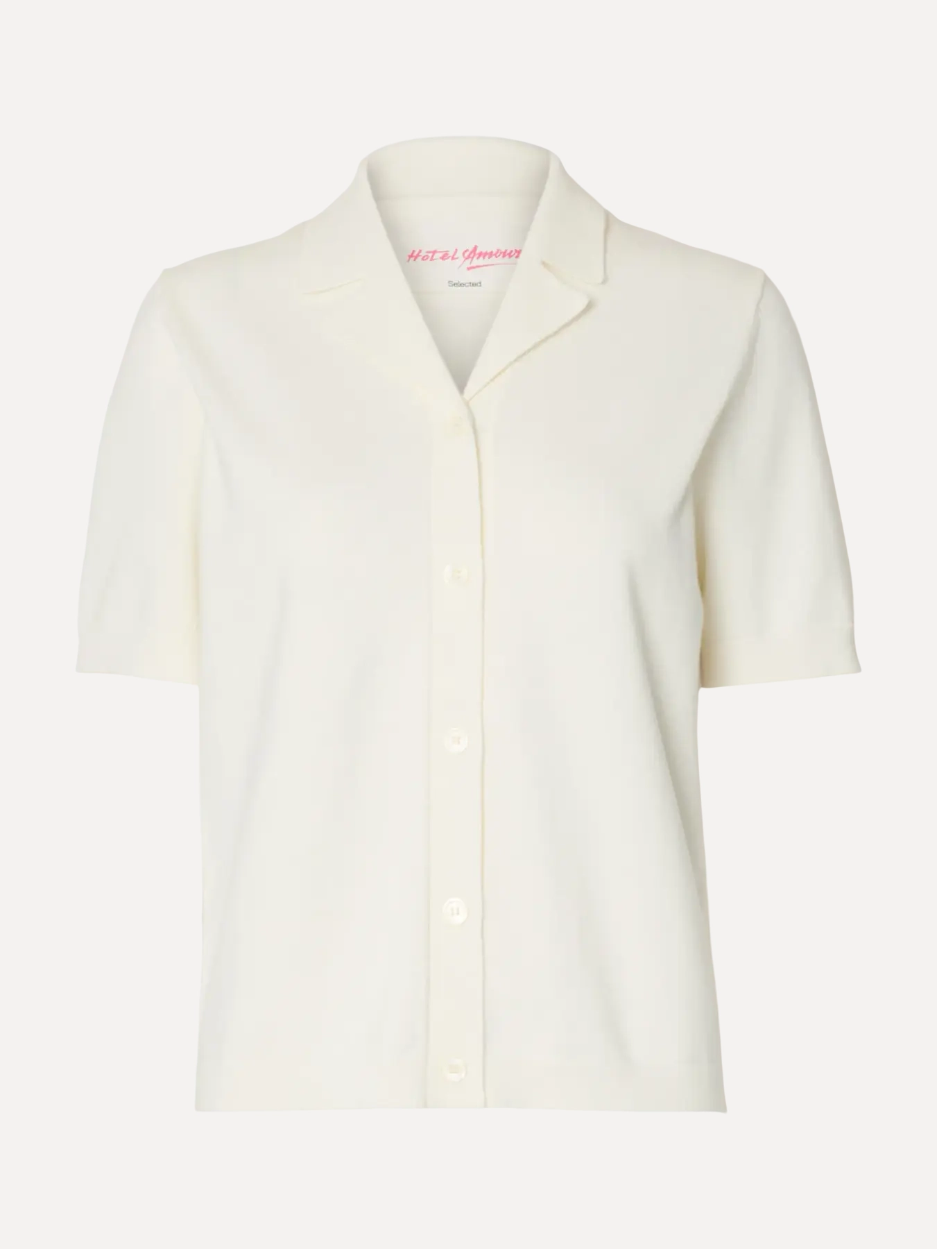 Selected polo en maille Amour 2. Less in front, more in the back. Ce cardigan polo associe un devant minimaliste à un art...