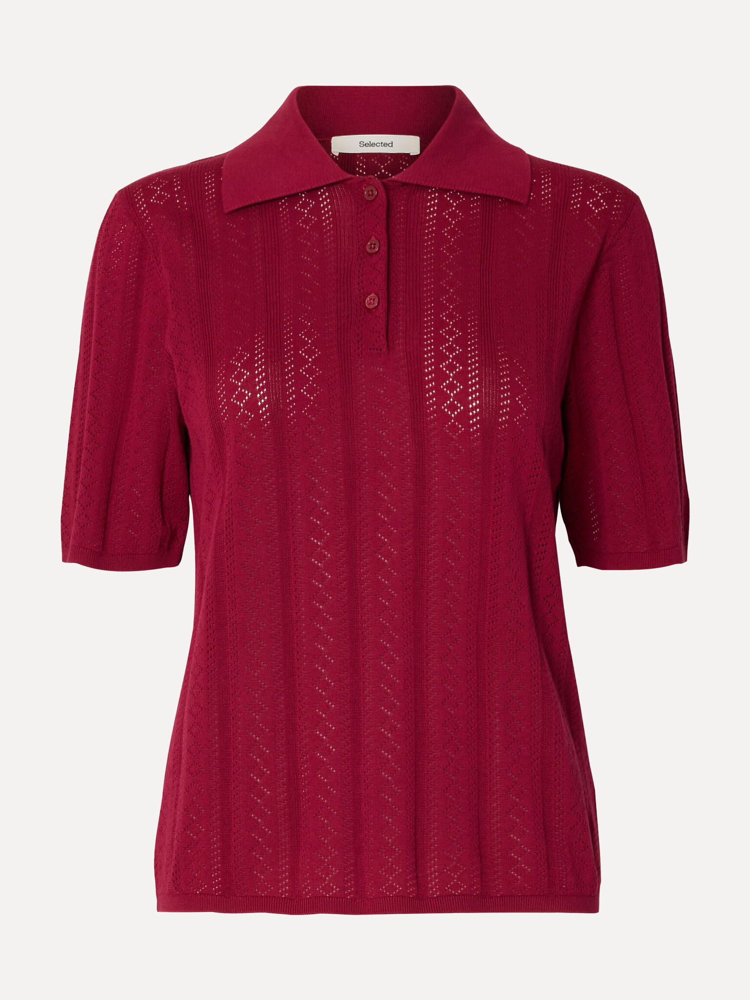 Selected  structure polo Toledo 2. Modern romance. De opengewerkte knit brengt detail en luchtigheid in het silhouet, ter...