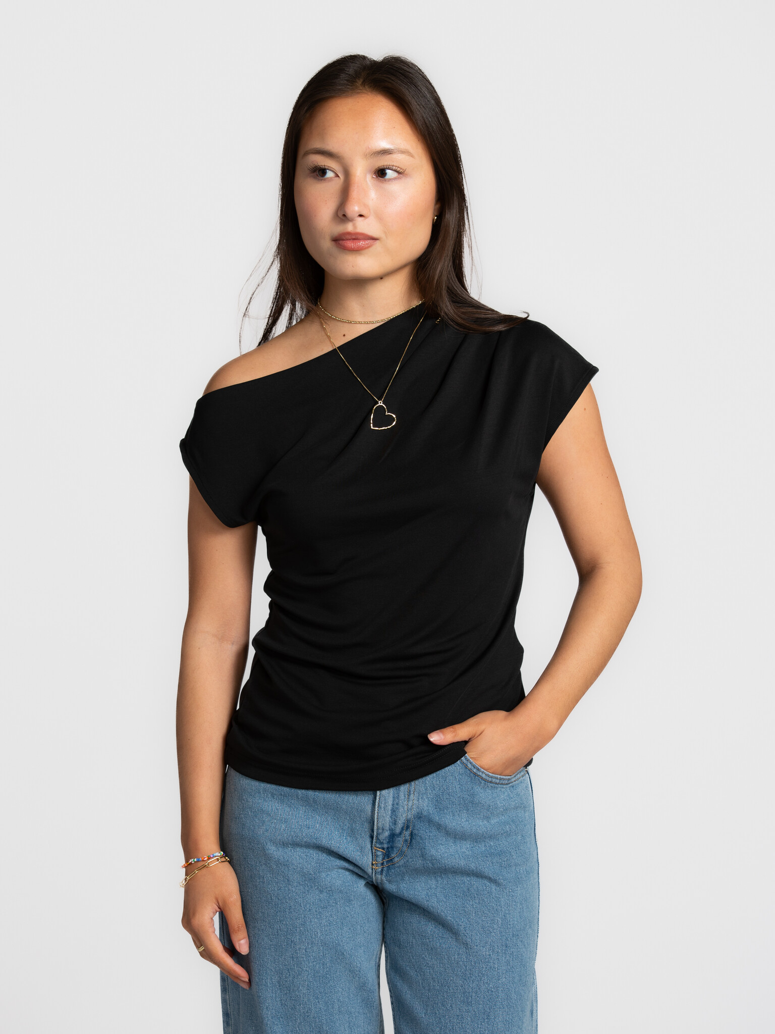Selected asymmetric top Molly 1. Modern minimalism at its best. The asymmetrical neckline and soft fabric create a subtle...