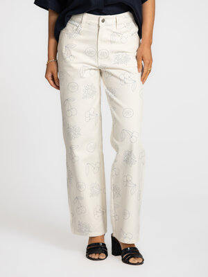 Denim Maru. Een broek met een glimlach. De speelse print en wijde pijpen brengen lichtheid in je outfit zonder in te boet...