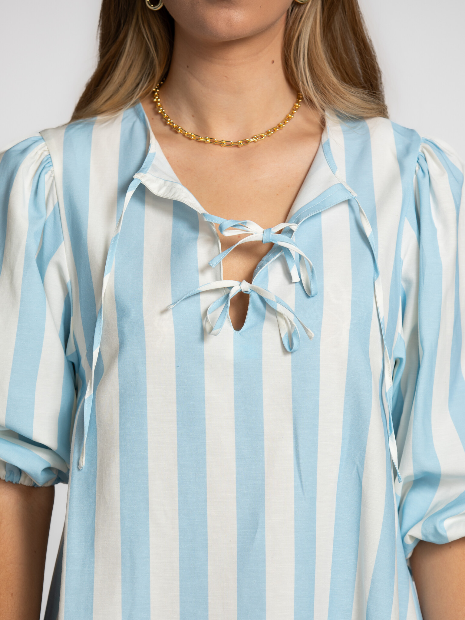 The tiny big sister striped puff sleeve dress 4. Statement in stripes. The bold stripes and subtle bow details give this ...