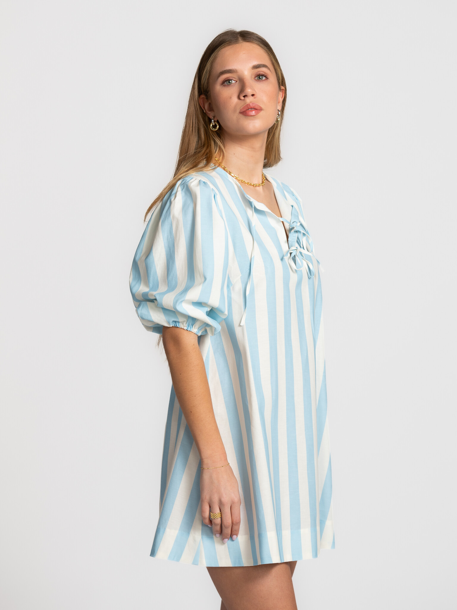 The tiny big sister striped puff sleeve dress 3. Statement in stripes. The bold stripes and subtle bow details give this ...