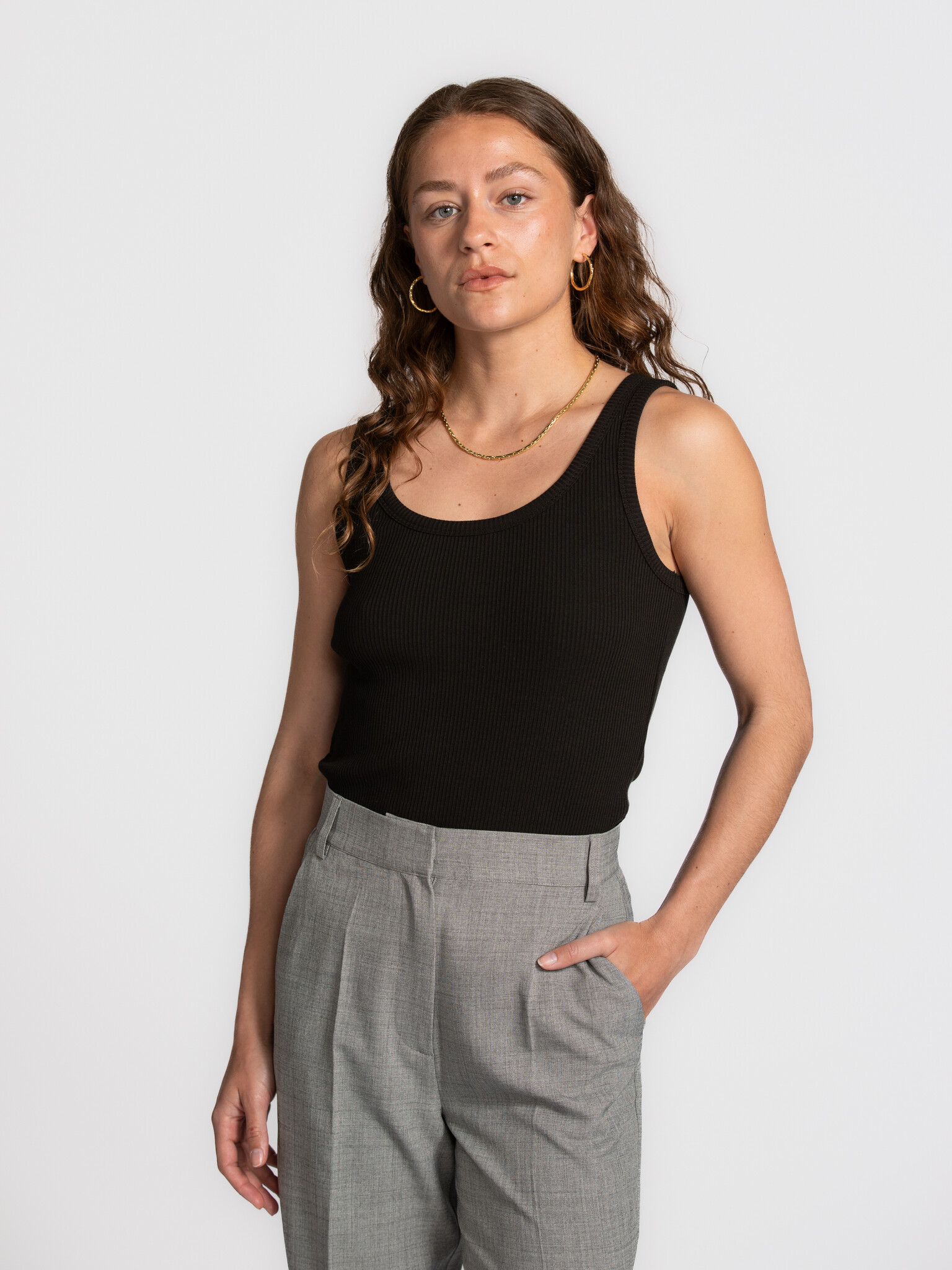 Selected ribbed tank top Anna 1. The power of black. This black tank top brings simplicity and elegance together. The rib...