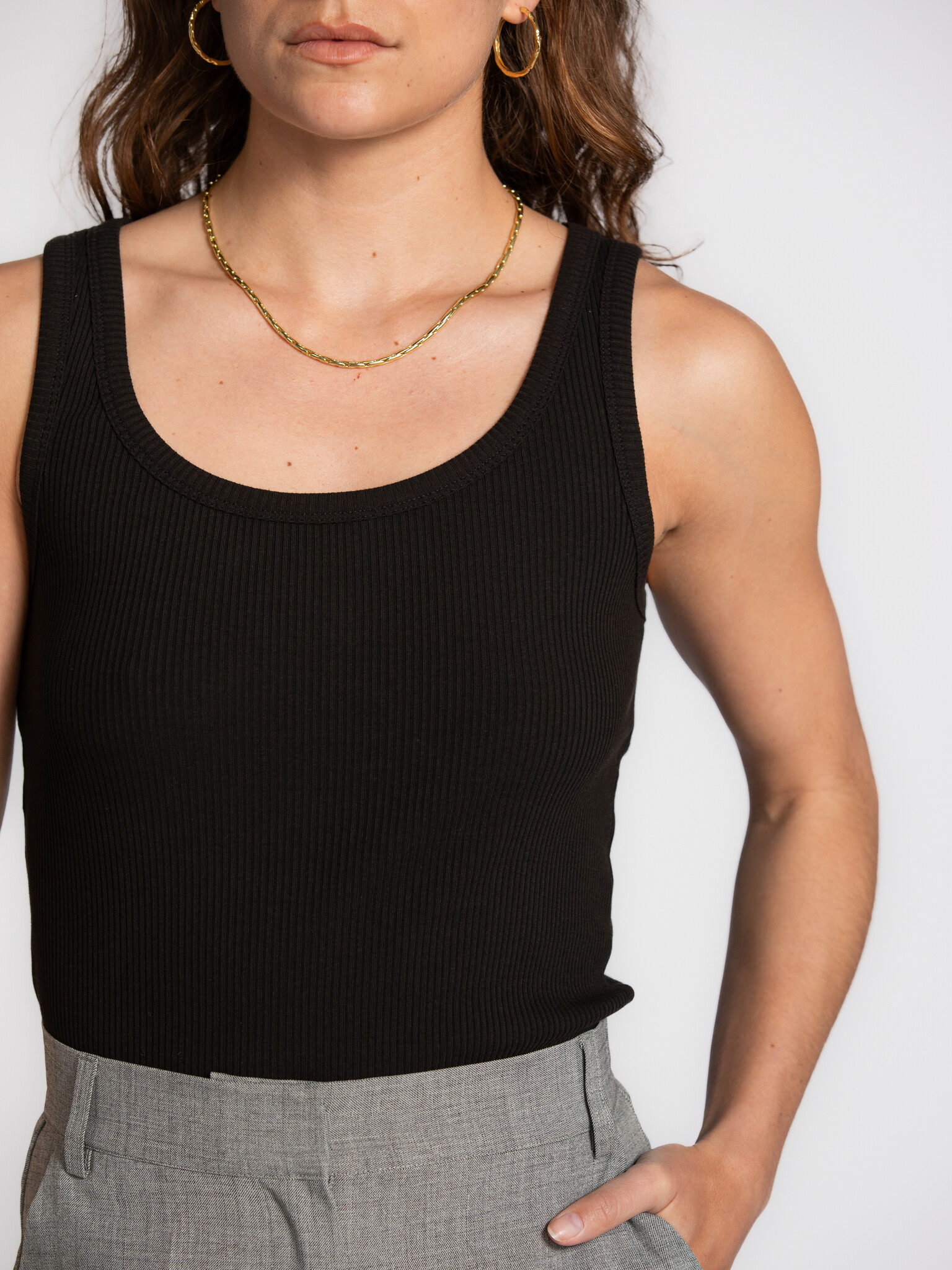 Selected ribbed tank top Anna 4. The power of black. This black tank top brings simplicity and elegance together. The rib...