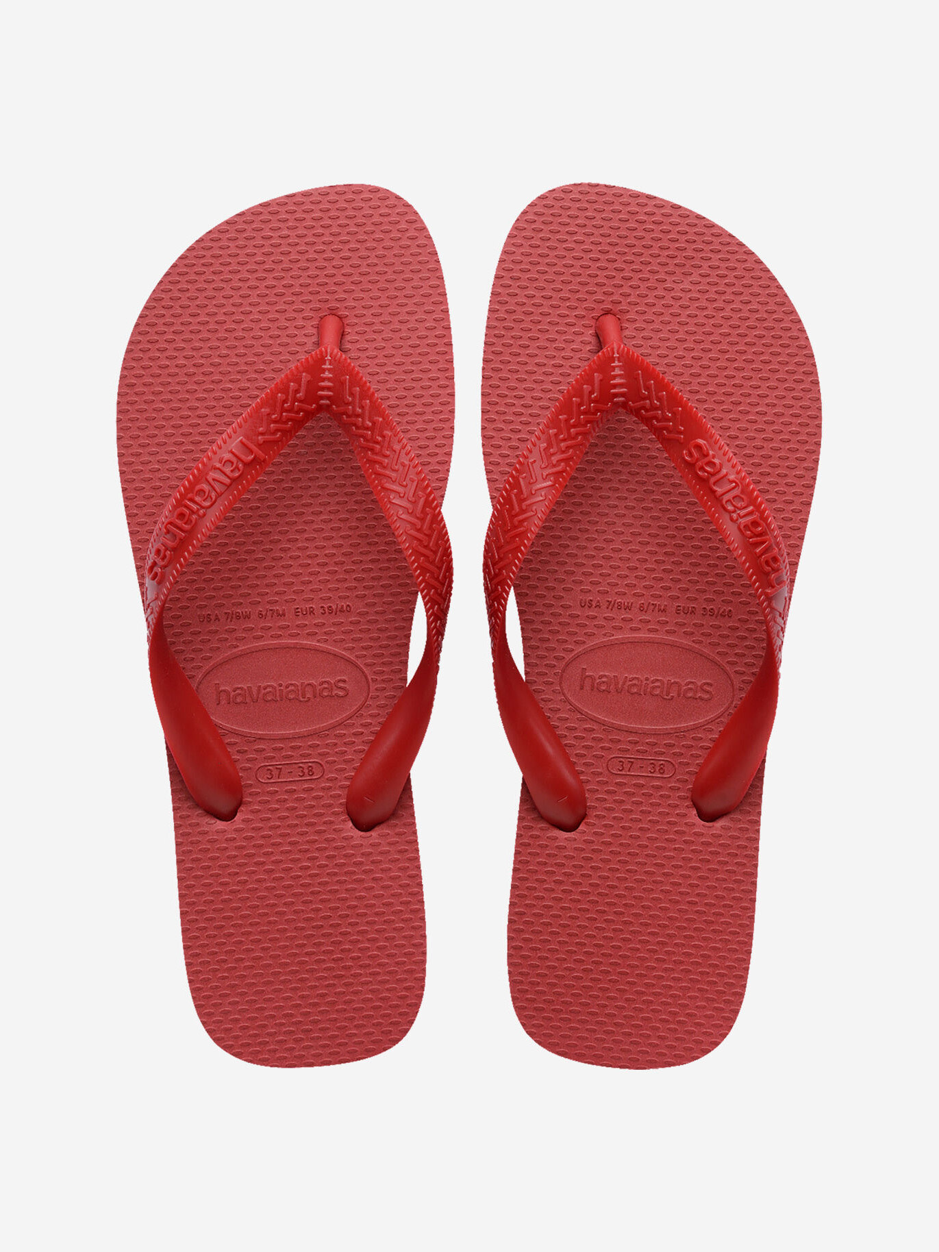 Havaianas Top 1. Een klein accent dat alles verandert. Deze rode slippers brengen warmte en energie in je look. Je schuif...