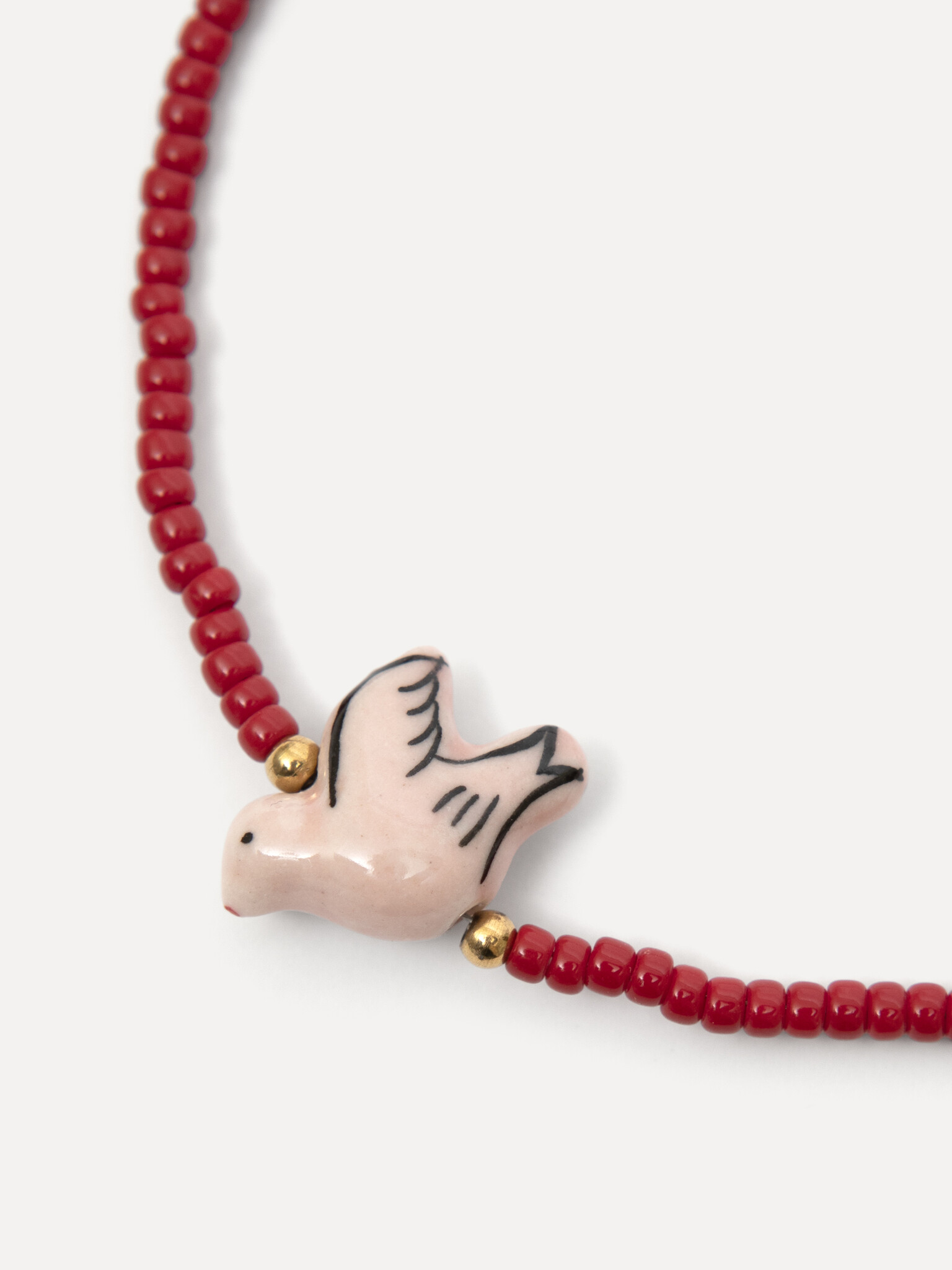 Les Soeurs necklace Aurora 2. Playful, yet full of character. This necklace with fine red beads feels light and summery, ...