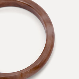 Les Soeurs resin Bangle 2. Banglin’ beauty. This round bangle in a warm marsala hue adds color and character to your look...