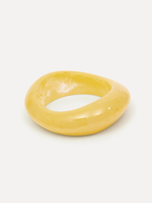 Resin Bangle. As if you’re carrying a piece of the sun. This bracelet has an organic shape that gently wraps around the w...