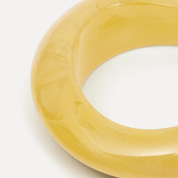 Les Soeurs resin Bangle 2. As if you’re carrying a piece of the sun. This bracelet has an organic shape that gently wraps...