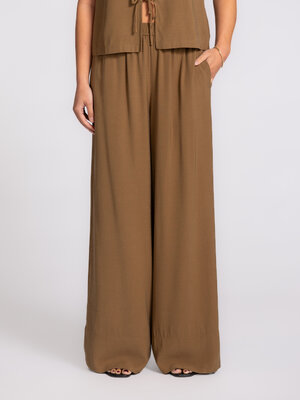 Trousers Cataleya. The airy fabric and wide fit give these trousers a relaxed elegance that transitions effortlessly from...