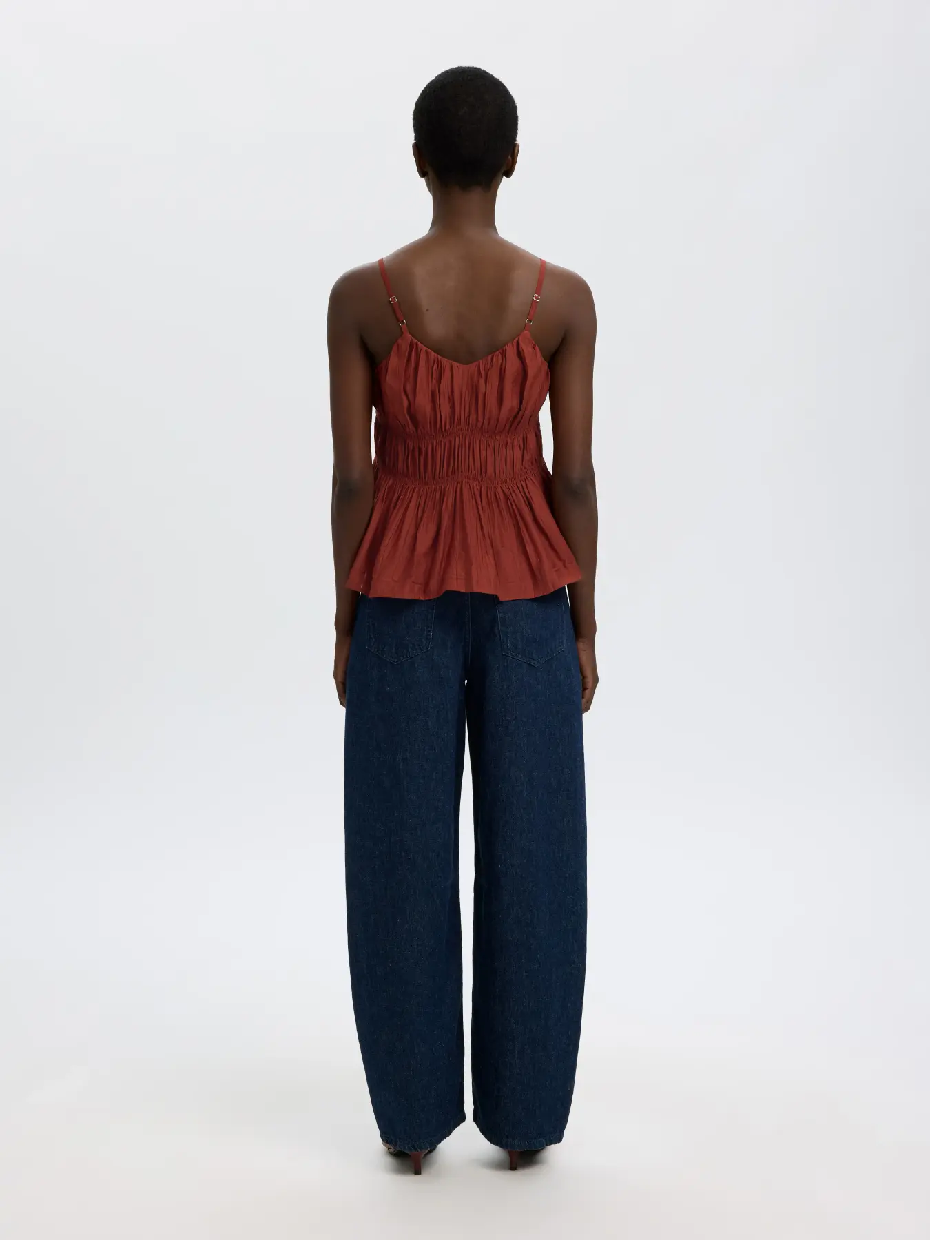 Selected smocked top Jackie 6. The charm lies in the details. The smocked finish gives this top a soft sense of movement ...