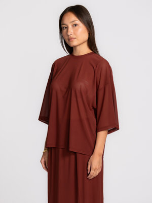 T-shirt Dallas. Light, airy and just a little different. The transparent mesh reveals just enough and subtly plays with w...