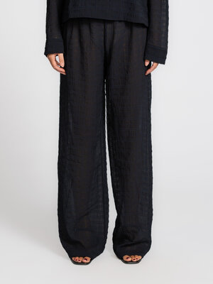 Trousers Ces. The straight, loose fit gives these trousers an effortless flow, while the subtle texture adds just enough ...