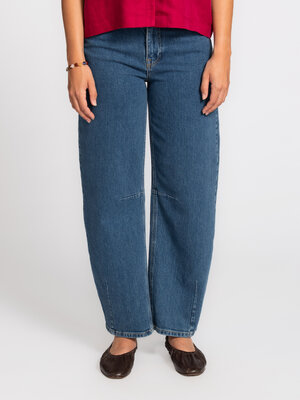 Jean Ane-Kori. The barrel leg is the new silhouette. These jeans play with volume and proportion, instantly giving your l...