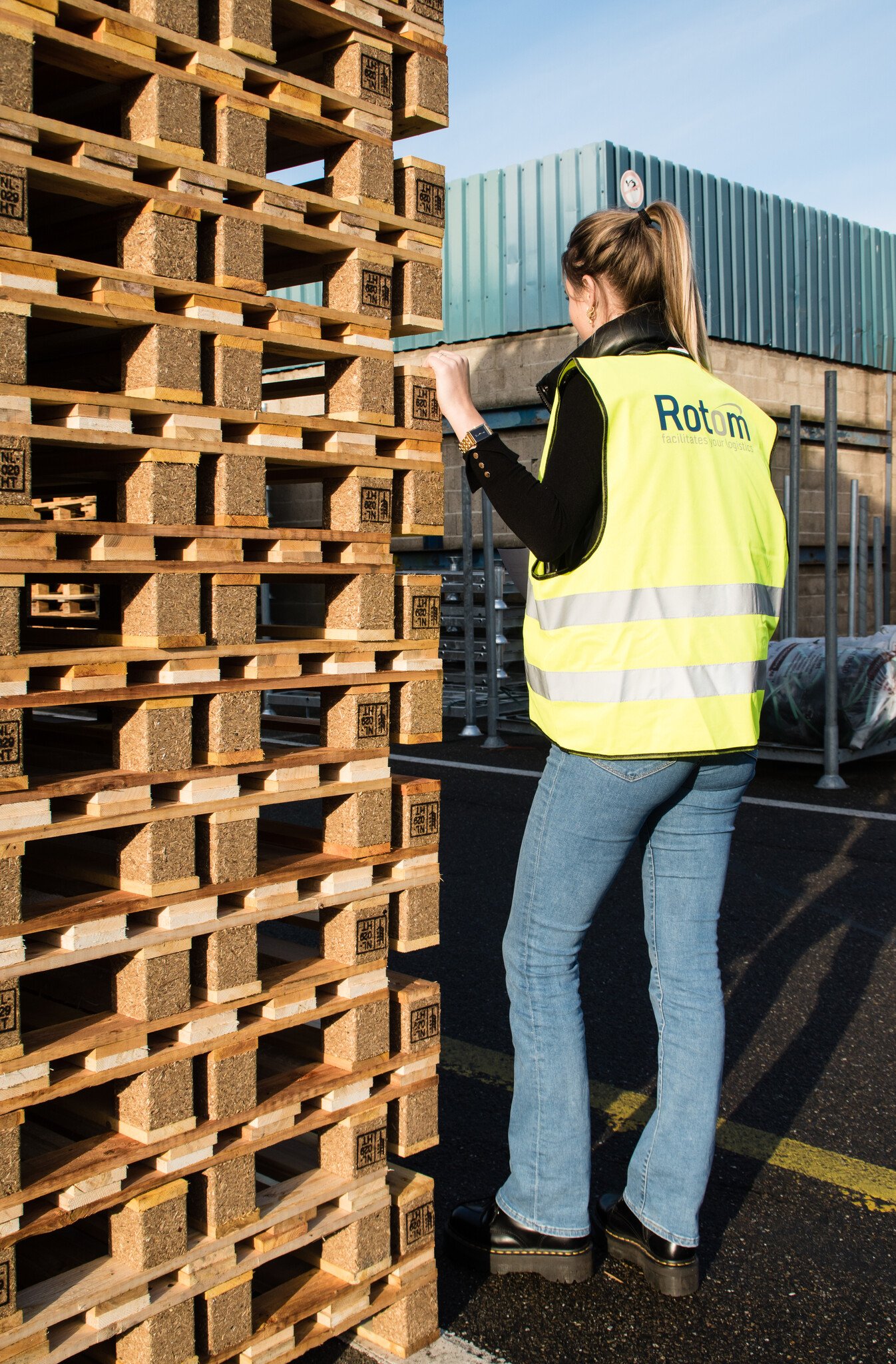 Nested wooden pallets on the company premises