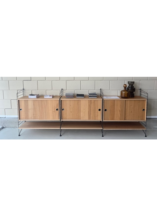 STRING wandkast met schuifdeuren van €2146 voor €950