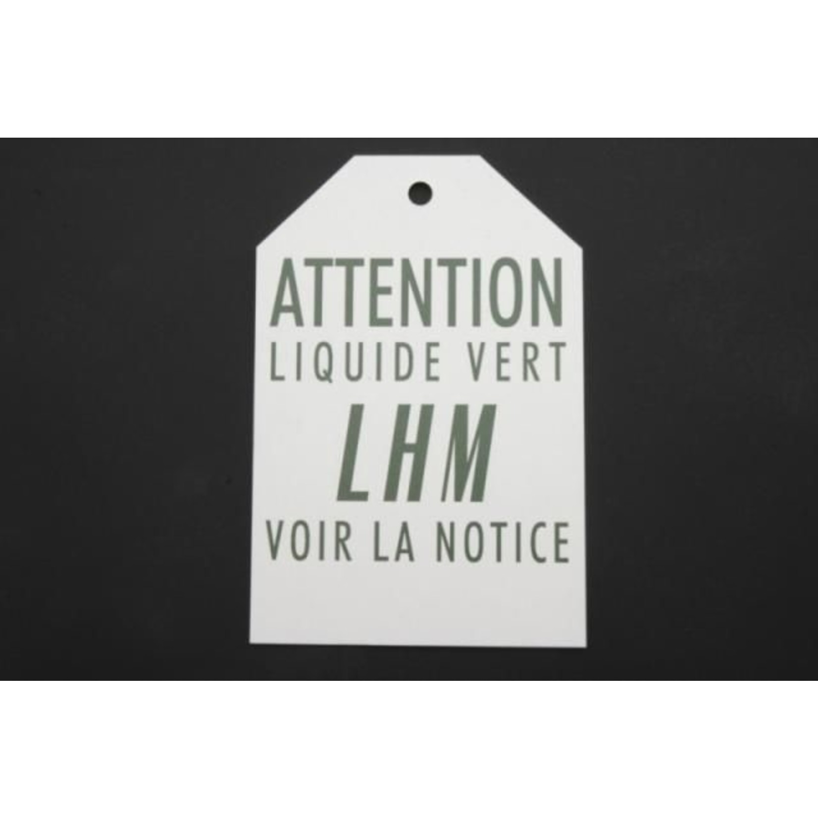 Sign "attention liquide vert, voir notice"