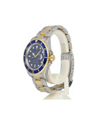 Rolex Submariner Date 40 steel - gold blue / bluesy Oyster 2006 + papers