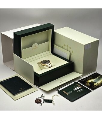 Rolex Submariner Date 40 2012 box + papers | yellow gold black ceramic