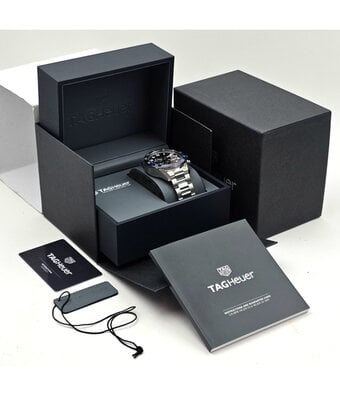 TAG Heuer Carrera Calibre Heuer 02 Chronograph GMT 45 steel skeleton black/blue bezel 2026 B+P