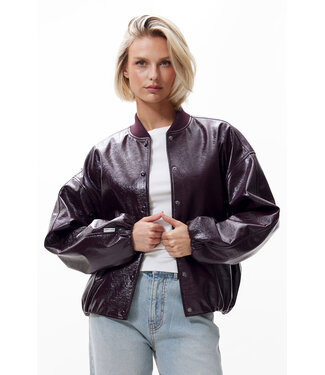Catwalk Junkie Tuck in varsity jacket