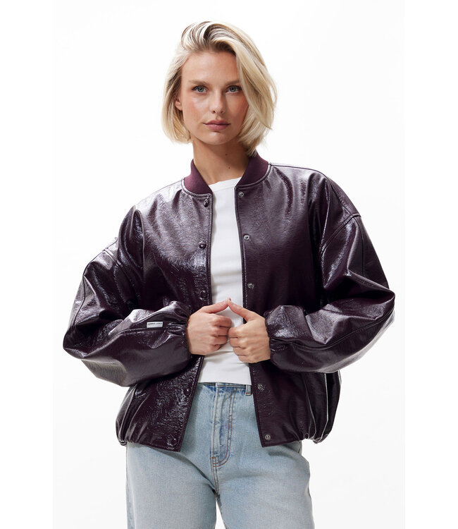 Catwalk Junkie Tuck in varsity jacket