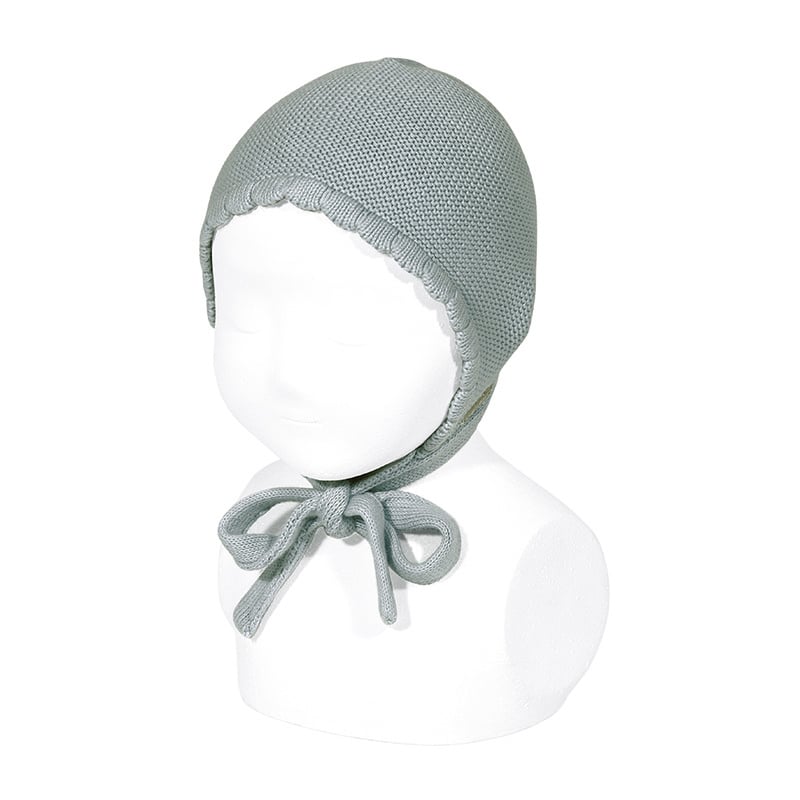 white knitted baby hat