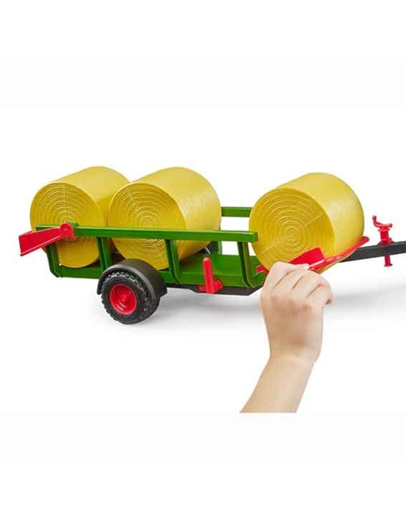 Bruder Bruder 2204 - Zelfladende balentrailer met 3 ronde hooibalen 1:16