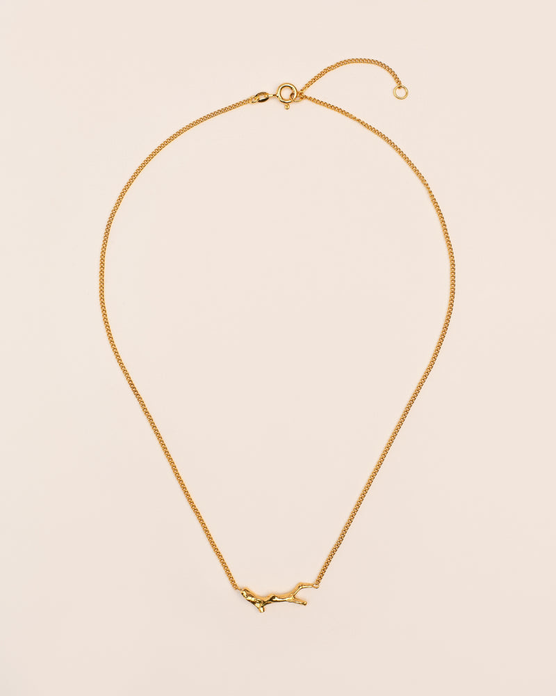 Necklace with branch-shaped element gold plated