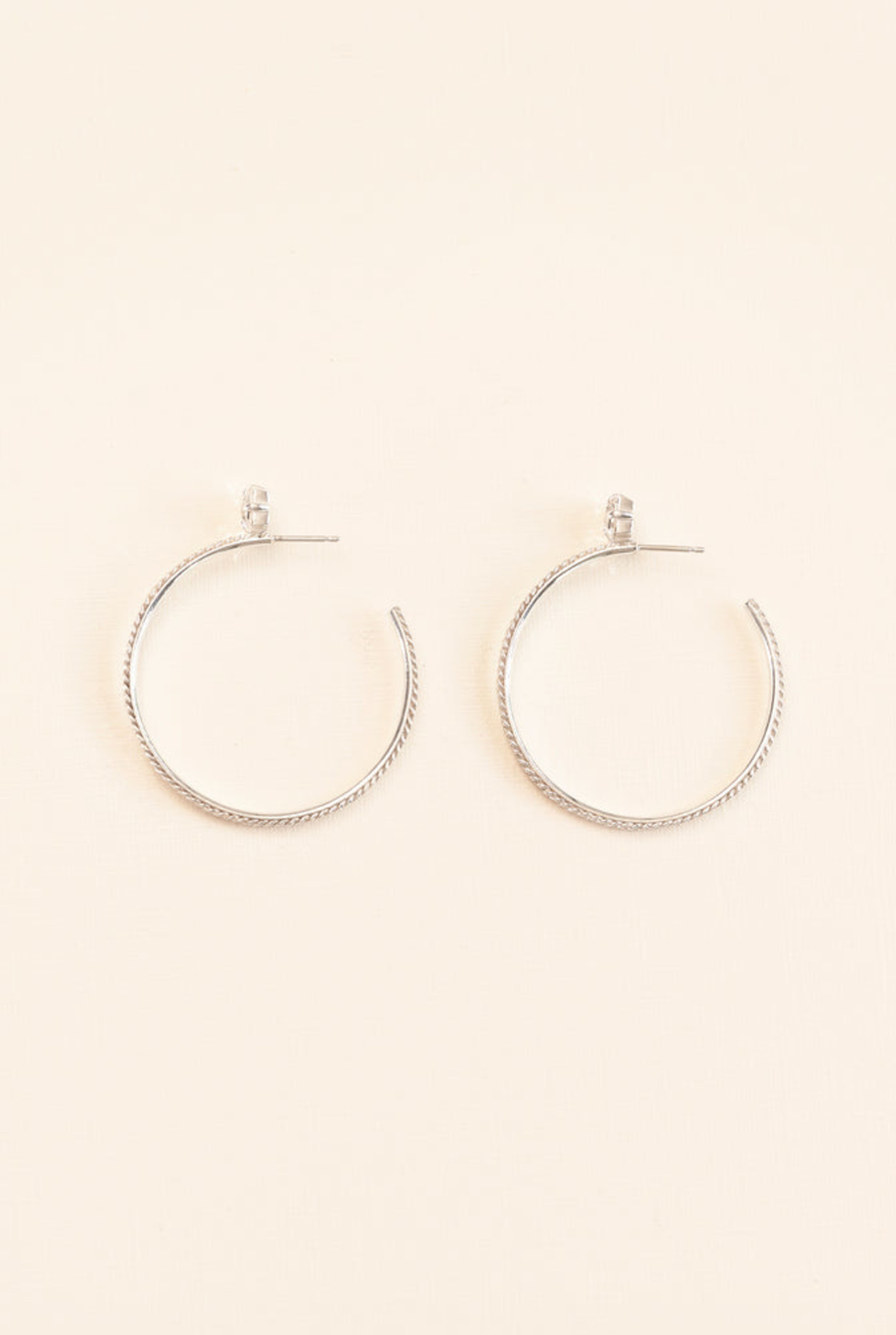 'Chapters' hoop earrings with crystal in silver